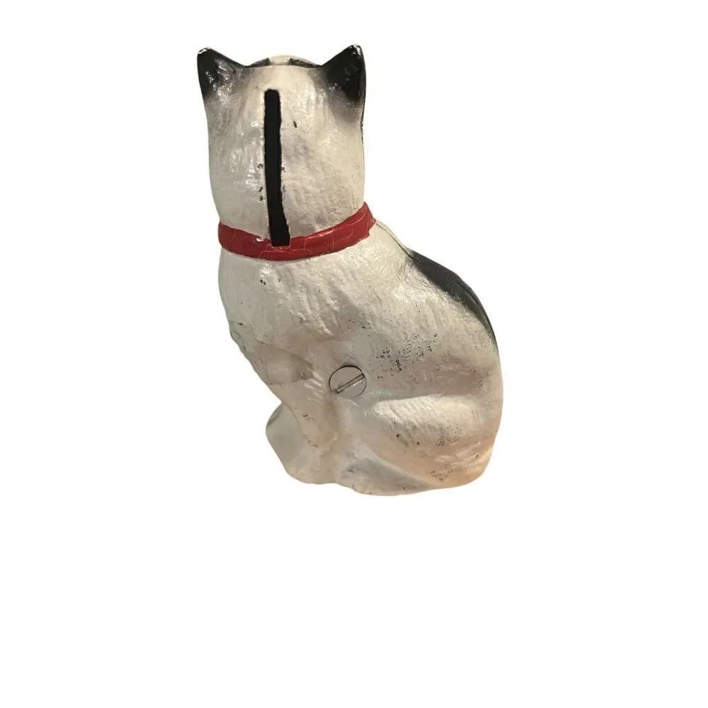 Retro cast iron cat with red bow penny bank by John Wright